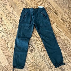 Dark gray , men’s pant, cargo style with cinched bottoms